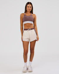 Woman wearing Elevated Accelerate Sports Bra - Cocoa Power-White | Model:Charli | Size:XS | Thumbnail Index: 3
