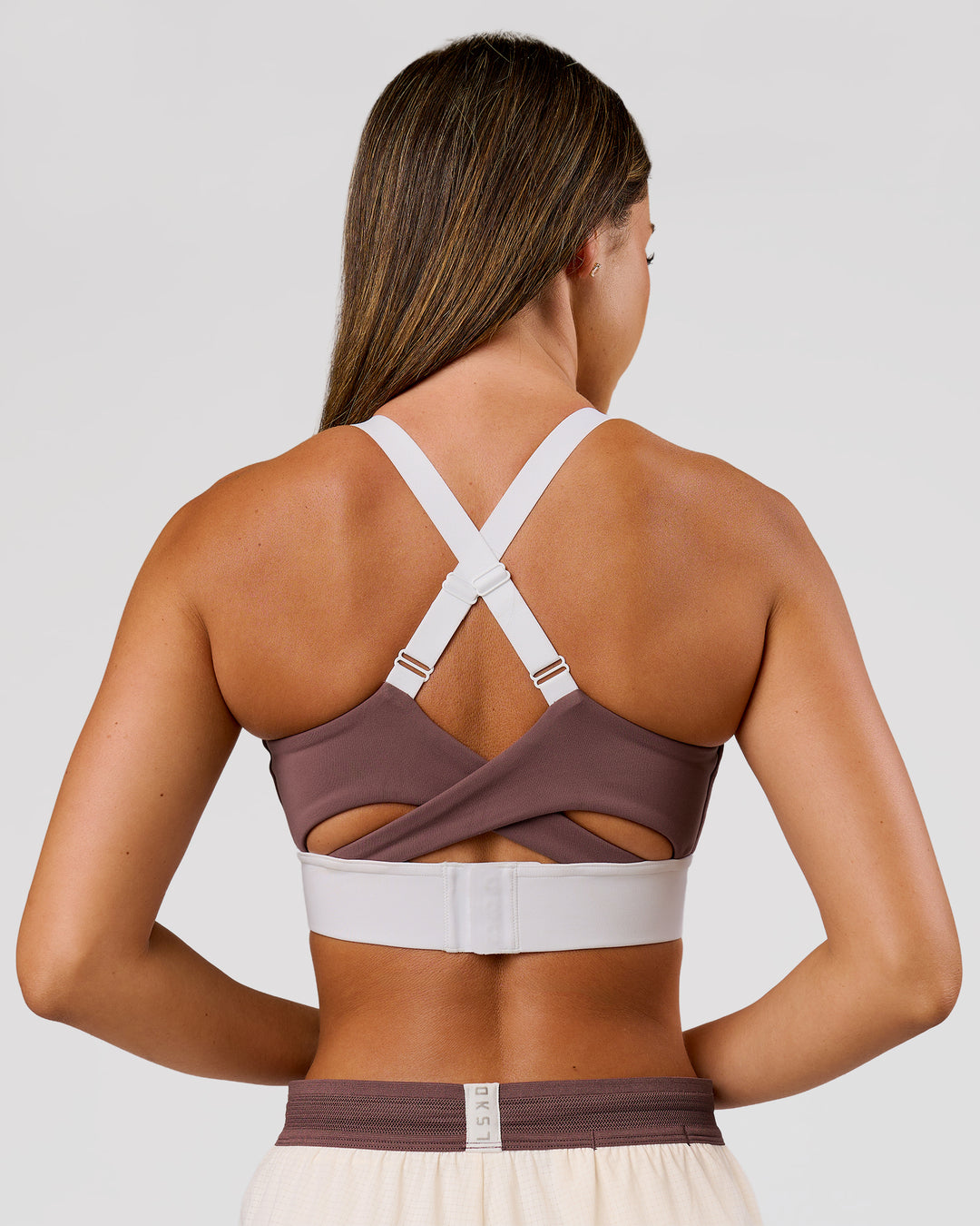 Woman wearing Elevated Accelerate Sports Bra - Cocoa Power-White | Model:Charli | Size:XS - view 8