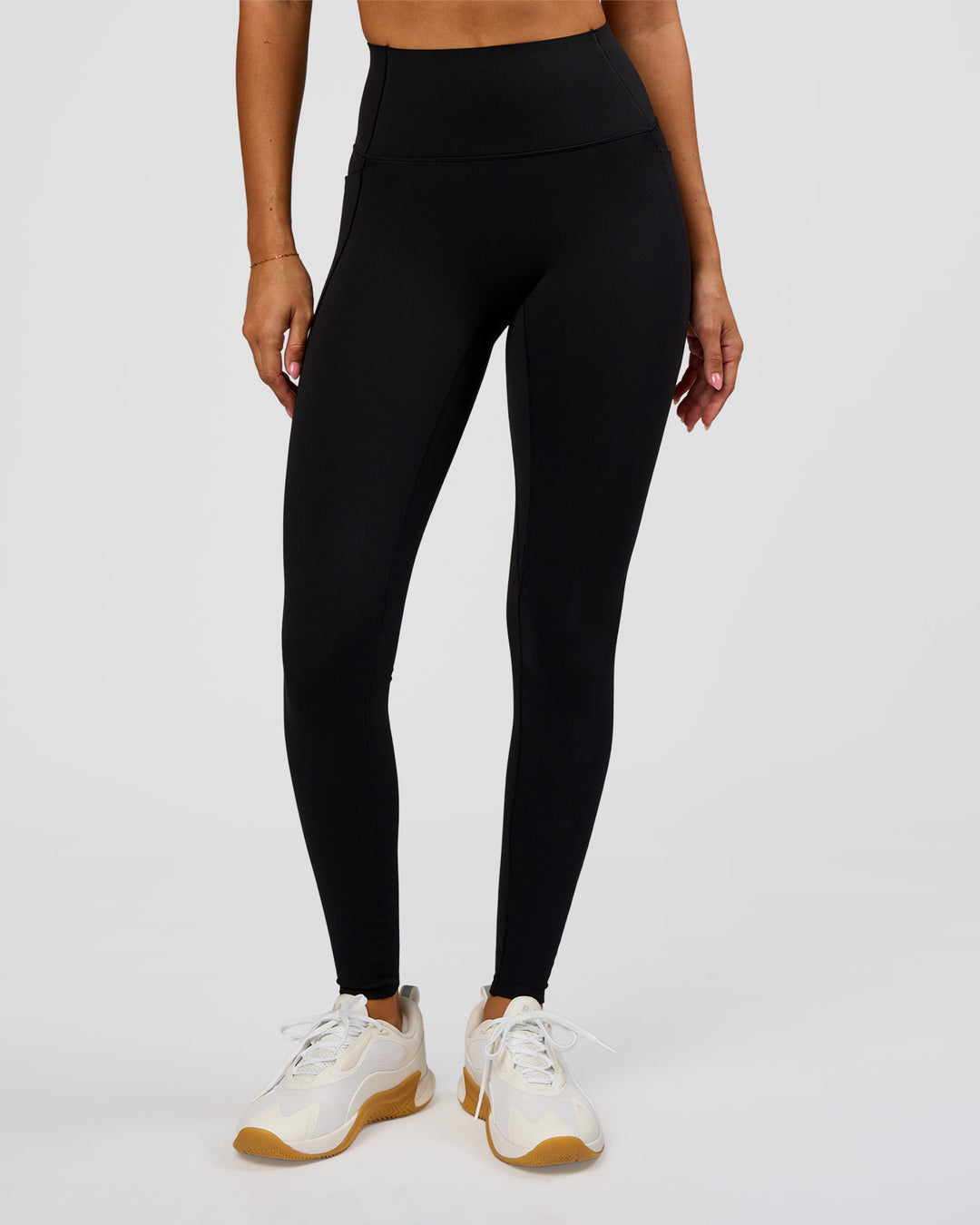 Woman wearing Fusion Bonded High-Rise Full Length Legging Pockets - Black | Model:Charli | Size:XS - view 1