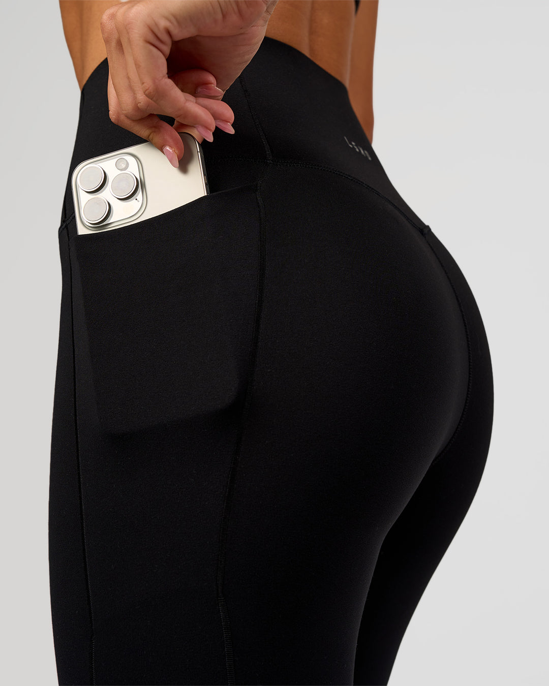 Woman wearing Fusion Bonded High-Rise Full Length Legging Pockets - Black | Model:Charli | Size:XS - view 3