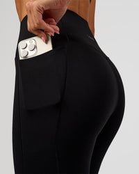 Woman wearing Fusion Bonded High-Rise Full Length Legging Pockets - Black | Model:Charli | Size:XS | Thumbnail Index: 2