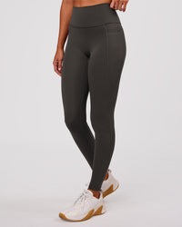 Woman wearing Fusion Ultra High-Rise Full Length Legging Pockets - Onyx | Model:Charli | Size:XS | Thumbnail Index: 4