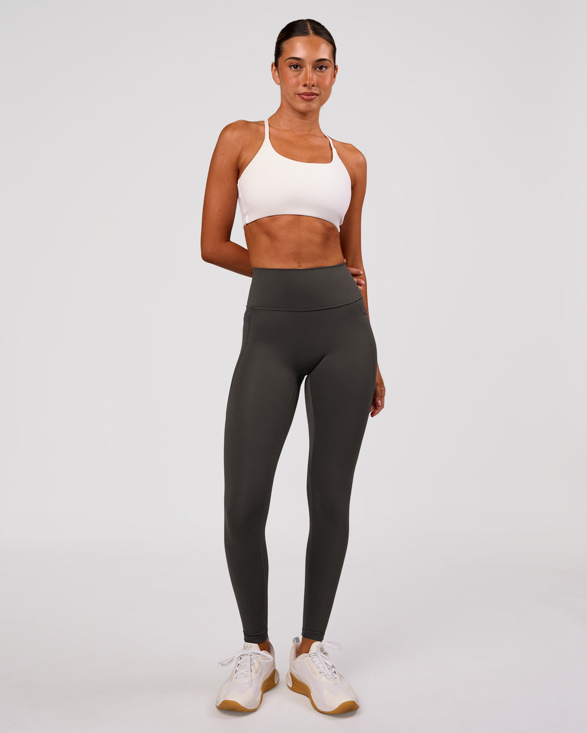 Woman wearing Fusion Ultra High-Rise Full Length Legging Pockets - Onyx | Model:Charli | Size:XS