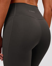 Woman wearing Fusion Ultra High-Rise Full Length Legging Pockets - Onyx | Model:Charli | Size:XS | Thumbnail Index: 5