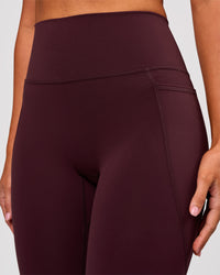 Woman wearing Fusion V Contour Ultra High-Rise 3/4 Legging Pockets - Cherry Lacquer | Model:Charli | Size:XS | Thumbnail Index: 5
