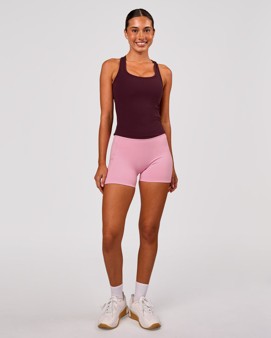 Woman wearing Fusion V-Contour Ultra High-Rise 4" Short Pockets - Pink Rose | Model:Charli | Size:XS - view 9