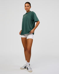 Woman wearing Go-To FLXCotton Oversized Tee - Transformative Teal Washed-White | Model:Charli | Size:XS | Thumbnail Index: 3