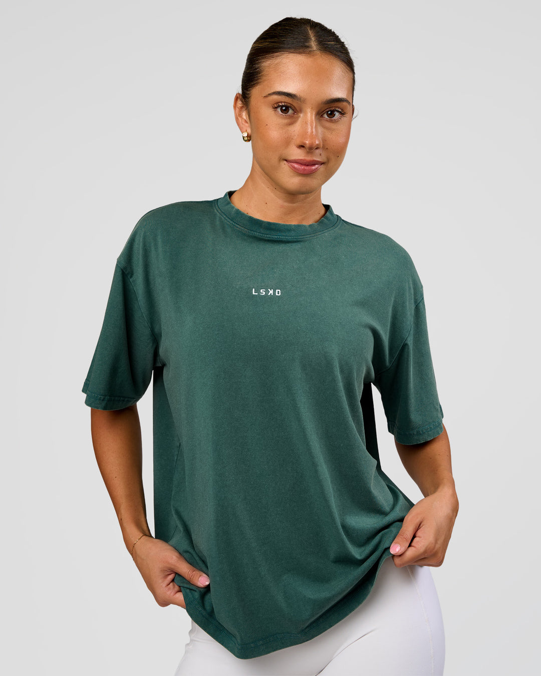 Woman wearing Go-To FLXCotton Oversized Tee - Transformative Teal Washed-White | Model:Charli | Size:XS - view 1