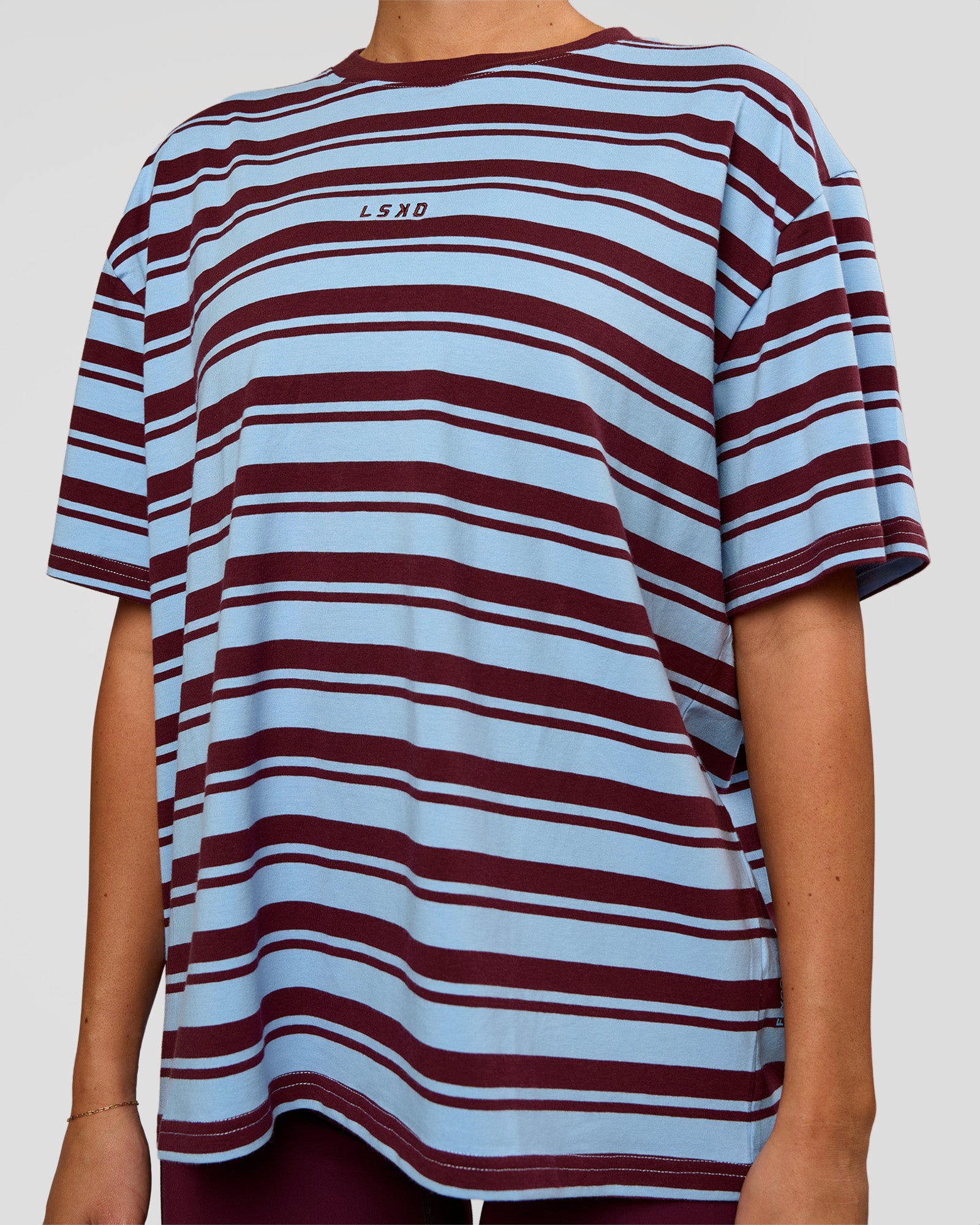 Woman wearing Go-To Shadow Stripe FLXCotton Oversized Tee - Open Air-Cherry Lacquer | Model:Charli | Size:XS