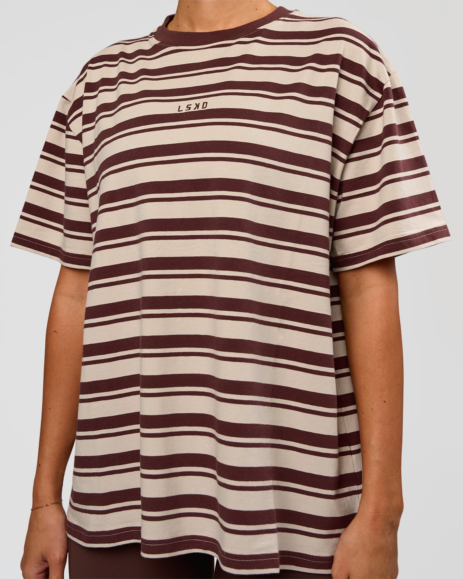 Woman wearing Go-To Shadow Stripe FLXCotton Oversized Tee - Shale Beige-Hot Chocolate | Model:Charli | Size:XS
