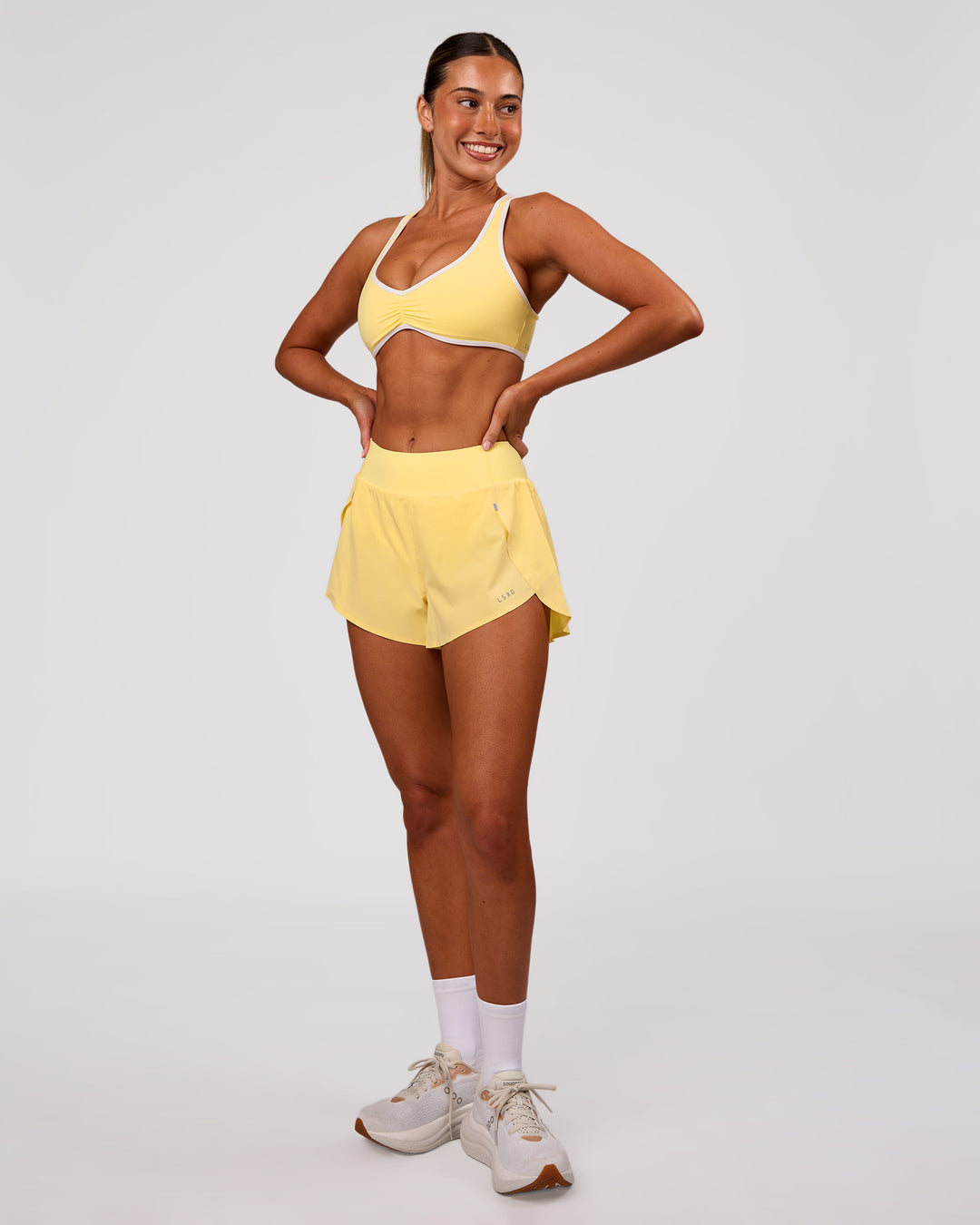 Woman wearing Luminous Sports Bra - Lemon-White | Model:Charli | Size:XS - view 5