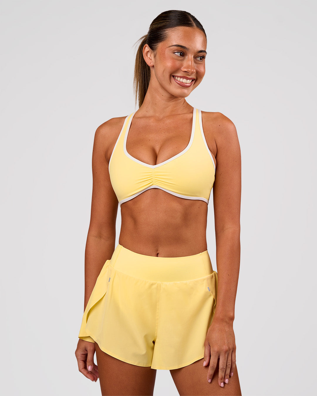 Woman wearing Luminous Sports Bra - Lemon-White | Model:Charli | Size:XS - view 6