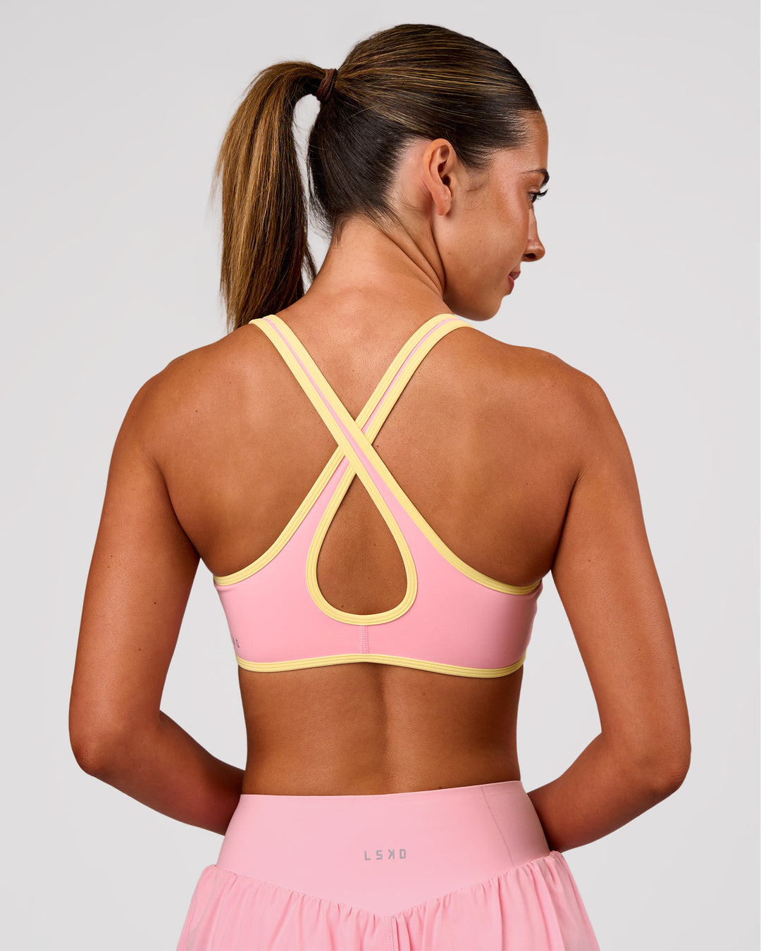 Woman wearing Luminous Sports Bra - Pink Rose-Lemon | Model:Charli | Size:XS - view 8
