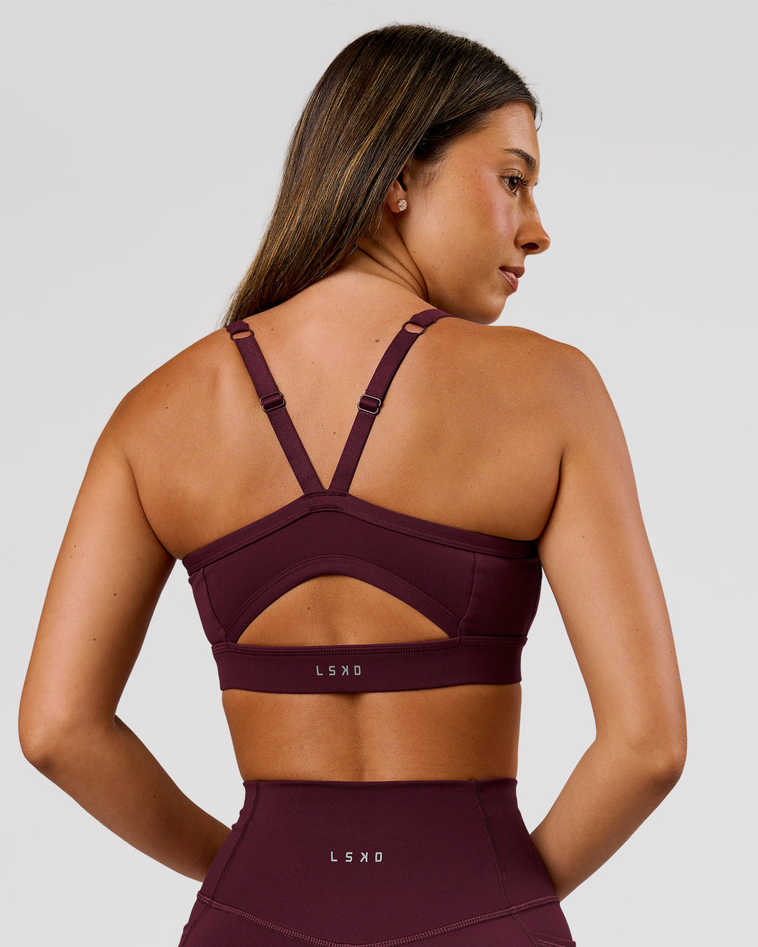 Woman wearing Momentum Sports Bra D/DD/E - Cherry Lacquer | Model:Charli | Size:XS - view 4