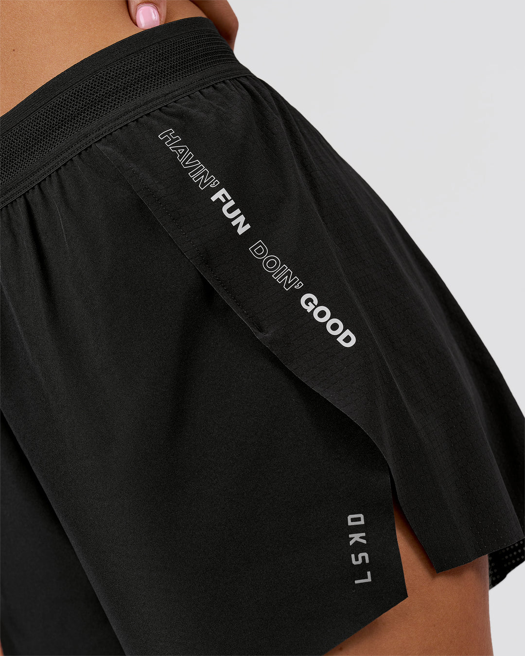 Woman wearing Movember x LSKD Accelerate 3" High-Rise Running Short - Black | Model:Charli | Size:XS - view 8
