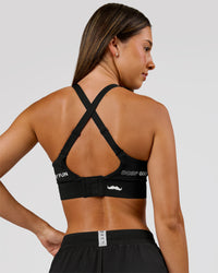 Woman wearing Movember x LSKD Accelerate Sports Bra - Black | Model:Charli | Size:XS | Thumbnail Index: 3