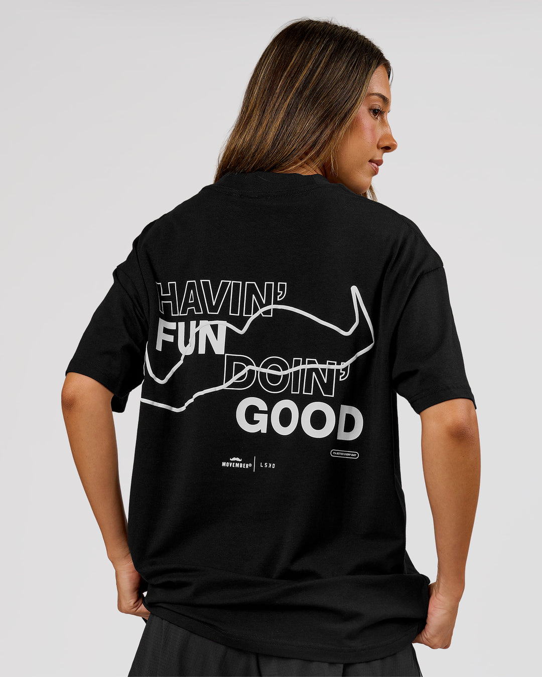 Woman wearing Movember x LSKD FLXCotton Oversize Tee - Black-White | Model:Charli | Size:XS - view 4