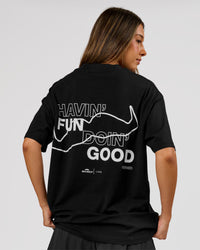 Woman wearing Movember x LSKD FLXCotton Oversize Tee - Black-White | Model:Charli | Size:XS | Thumbnail Index: 3
