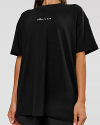 Woman wearing Movember x LSKD FLXCotton Oversize Tee - Black-White | Model:Charli | Size:XS | Thumbnail Index: 7
