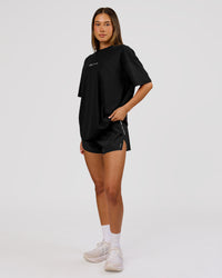 Woman wearing Movember x LSKD FLXCotton Oversize Tee - Black-White | Model:Charli | Size:XS | Thumbnail Index: 9
