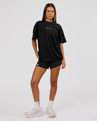 Woman wearing Movember x LSKD FLXCotton Oversize Tee - Black-White | Model:Charli | Size:XS | Thumbnail Index: 13