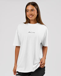 Woman wearing Movember x LSKD FLXCotton Oversize Tee - White-Black | Model:Charli | Size:XS | Thumbnail Index: 5