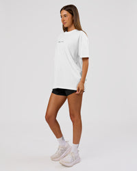 Woman wearing Movember x LSKD FLXCotton Oversize Tee - White-Black | Model:Charli | Size:XS | Thumbnail Index: 11