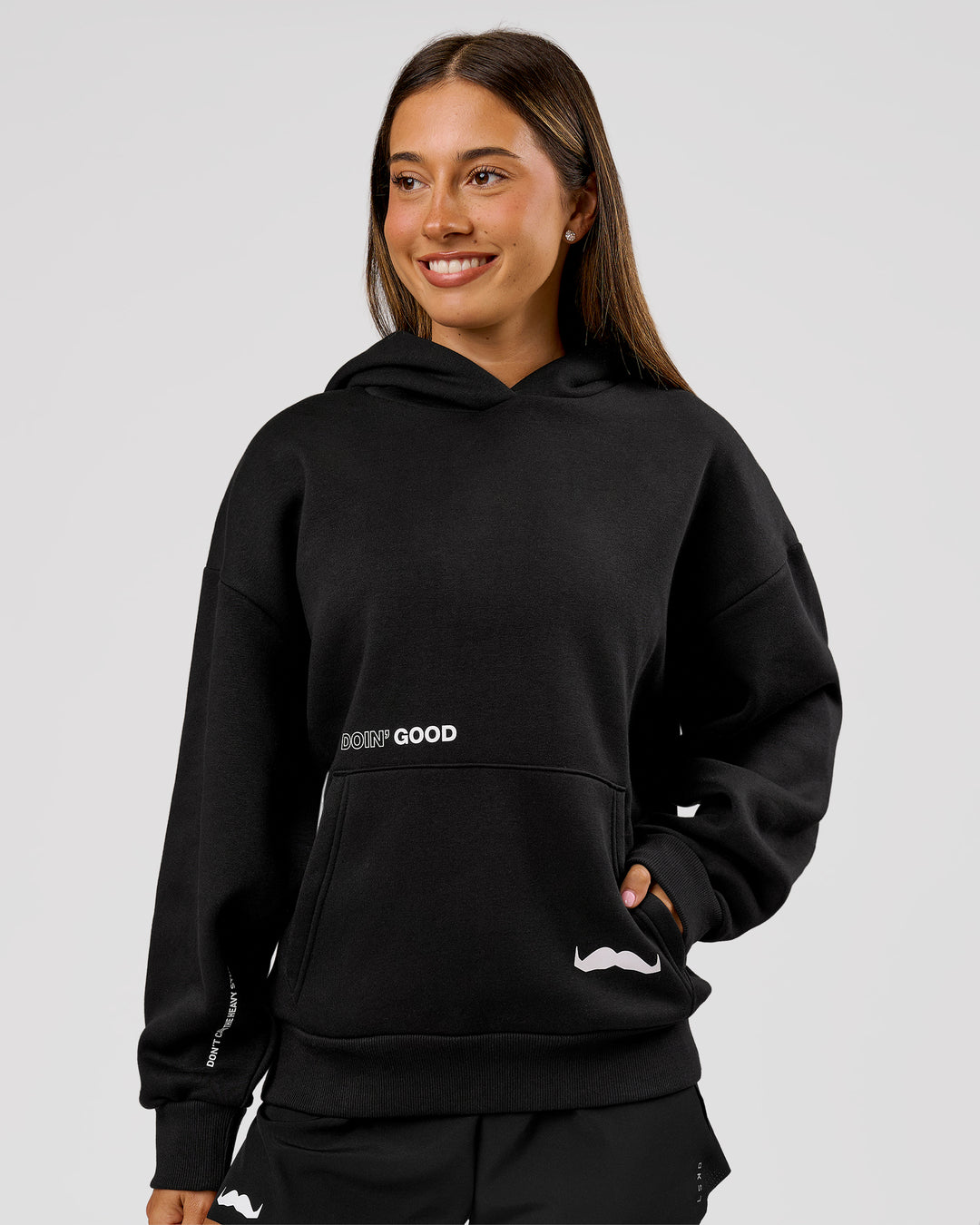 Woman wearing Movember x LSKD Oversized Hoodie - Black | Model:Charli | Size:XS - view 3