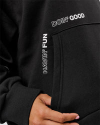 Woman wearing Movember x LSKD Oversized Hoodie - Black | Model:Charli | Size:XS | Thumbnail Index: 11