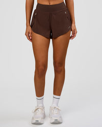 Woman wearing Pacer 3" Run Short - Hot Chocolate | Model:Charli | Size:XS | Thumbnail Index: 2