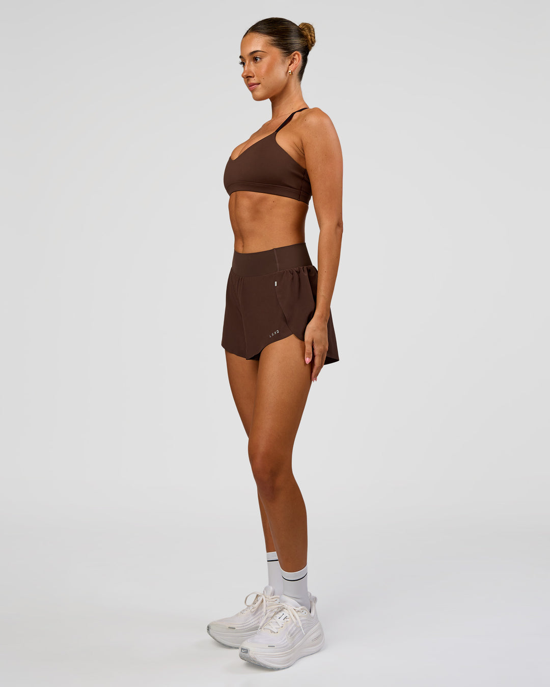 Woman wearing Pacer 3" Run Short - Hot Chocolate | Model:Charli | Size:XS - view 5