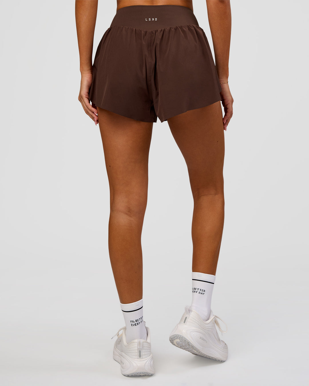 Woman wearing Pacer 3" Run Short - Hot Chocolate | Model:Charli | Size:XS - view 8