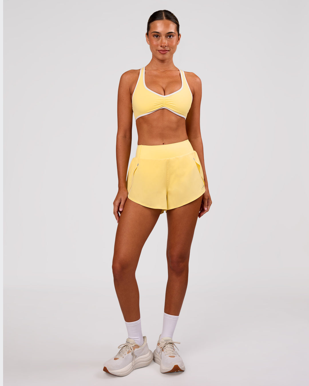 Woman wearing Pacer 3" Run Short - Lemon | Model:Charli | Size:XS - view 3