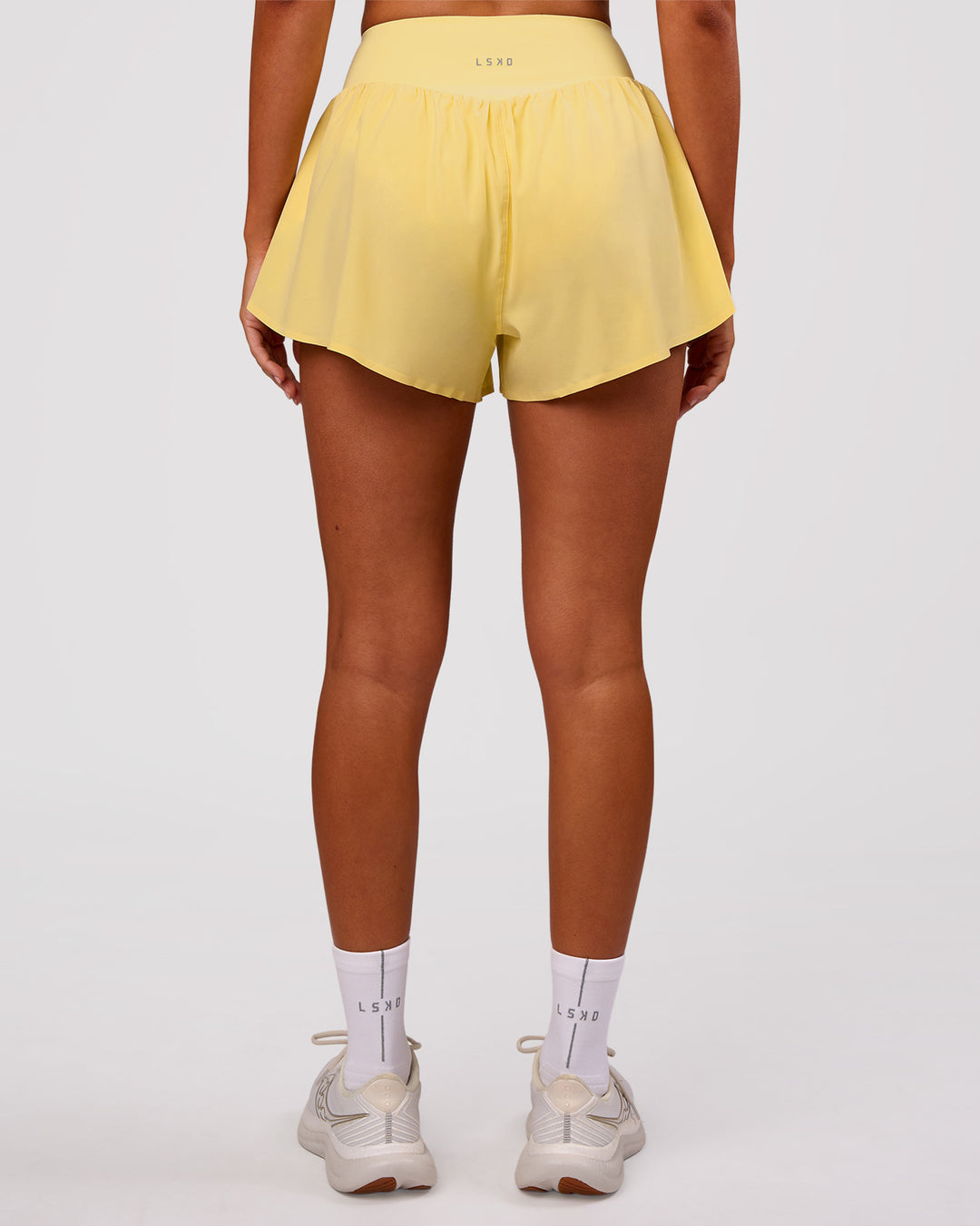 Woman wearing Pacer 3" Run Short - Lemon | Model:Charli | Size:XS - view 7