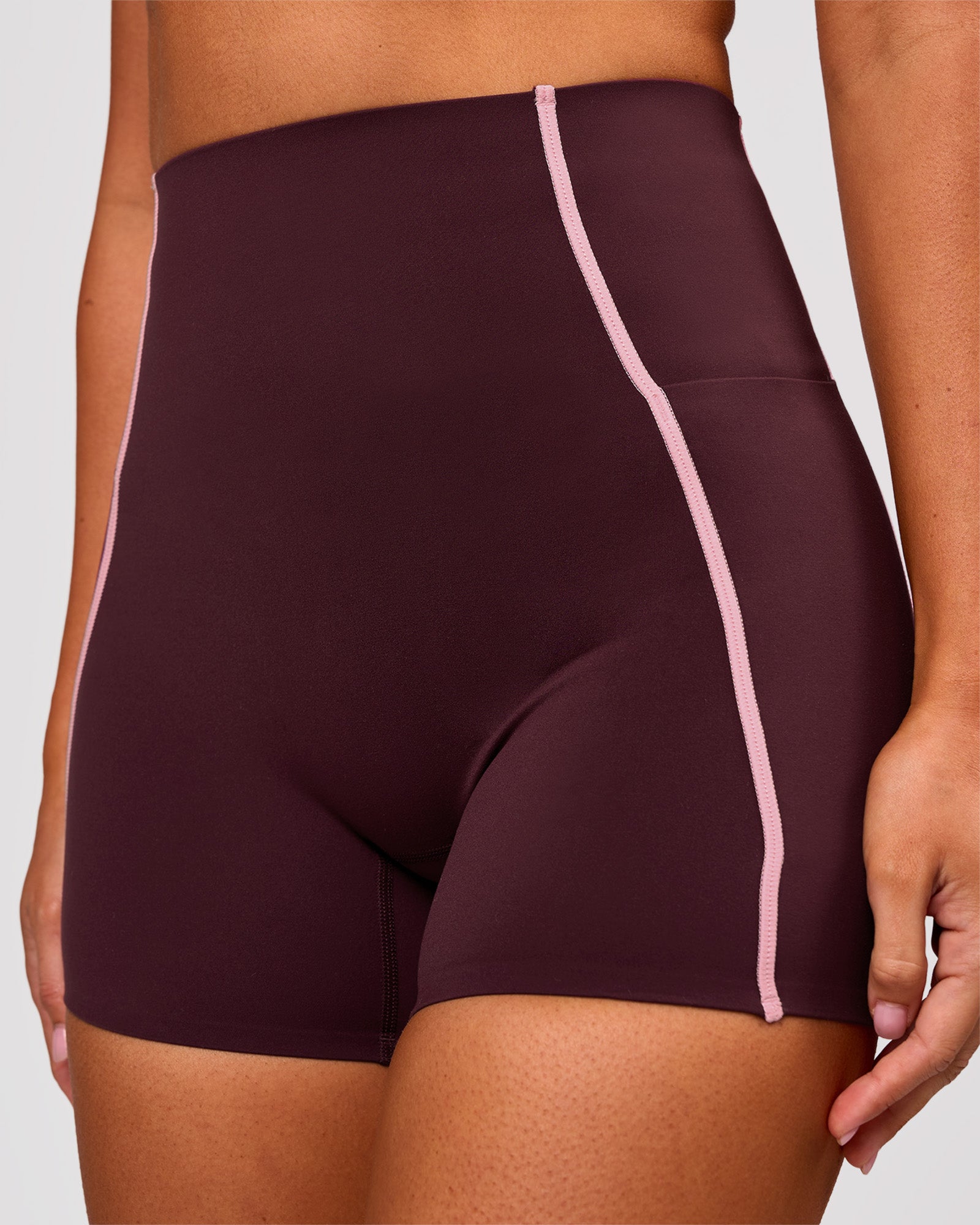 Woman wearing Power Ultra High-Rise 4" Short Pockets - Cherry Lacquer-Pink Rose | Model:Charli | Size:XS