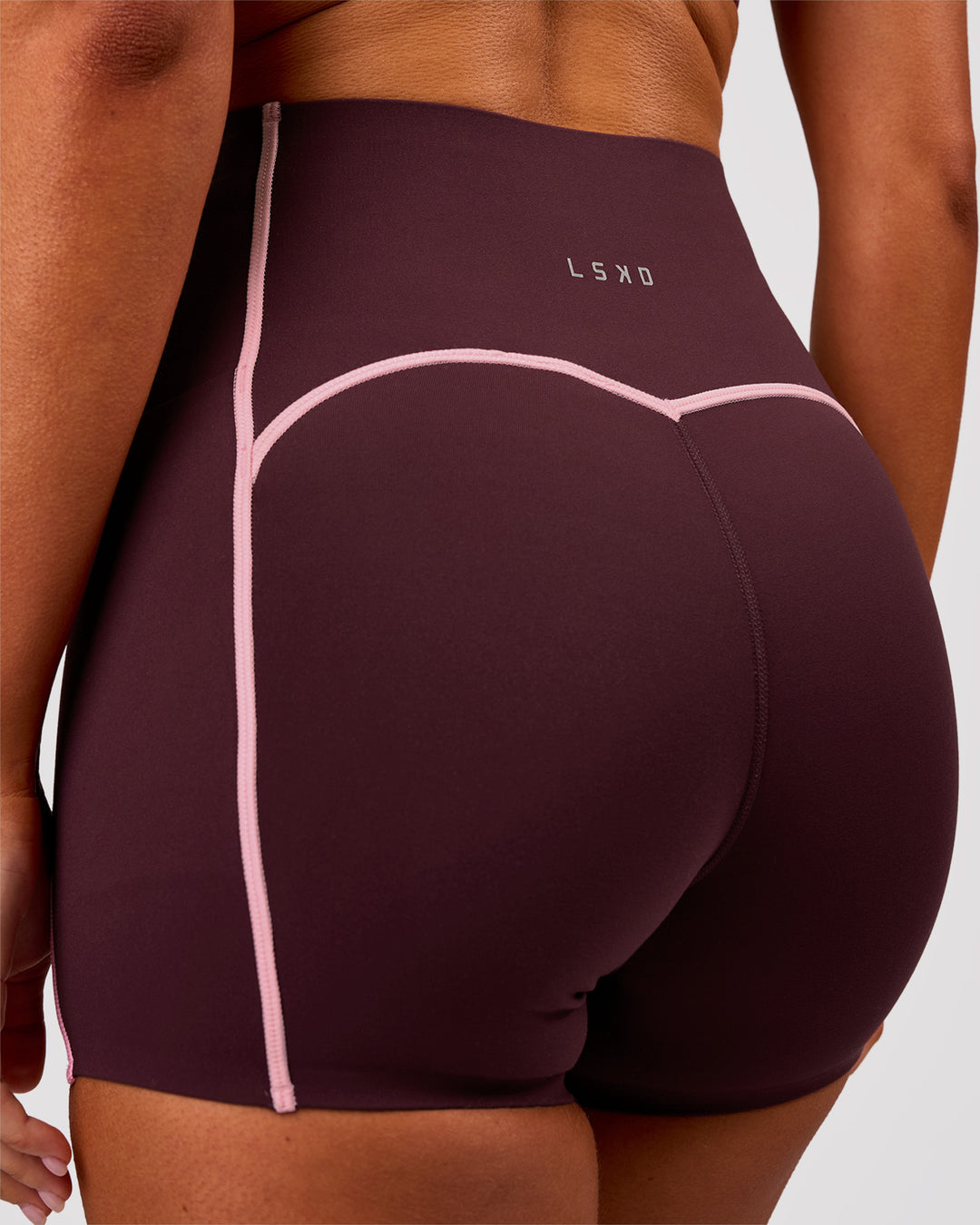 Woman wearing Power Ultra High-Rise 4" Short Pockets - Cherry Lacquer-Pink Rose | Model:Charli | Size:XS - view 2