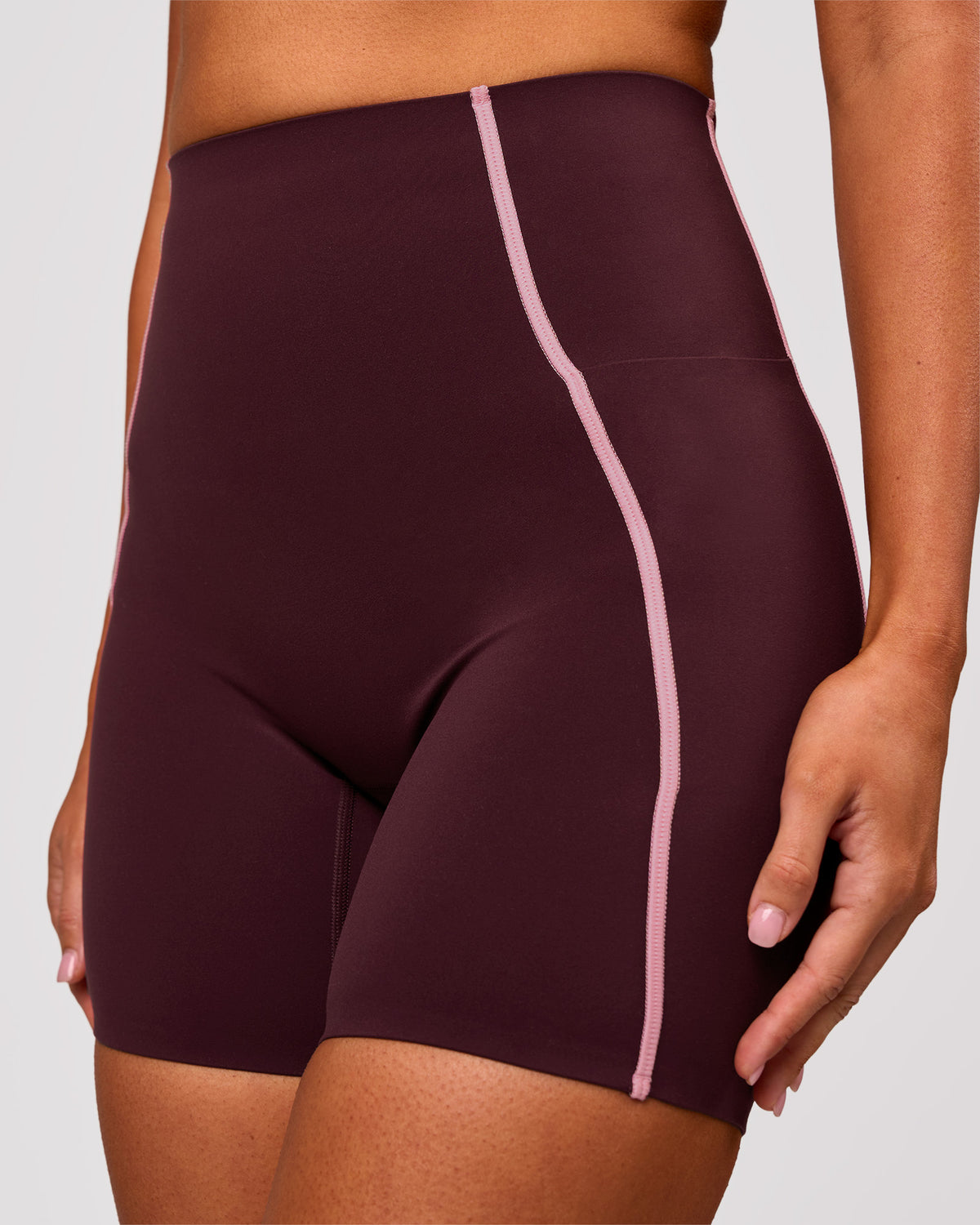Woman wearing Power Ultra High-Rise 6" Short Pockets - Cherry Lacquer-Pink Rose | Model:Charli | Size:XS