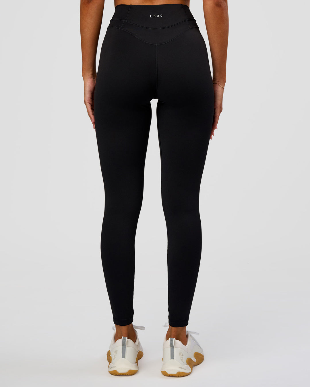 Woman wearing Solstice High-Rise Full Length Legging - Black | Model:Charli | Size:XS - view 5