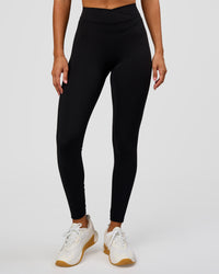Woman wearing Solstice High-Rise Full Length Legging - Black | Model:Charli | Size:XS | Thumbnail Index: 7