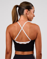 Woman wearing Stellar Long Line Sports Bra - Black-White | Model:Charli | Size:XS | Thumbnail Index: 6