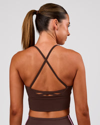 Woman wearing Stellar Long Line Sports Bra - Hot Chocolate | Model:Charli | Size:XS | Thumbnail Index: 1