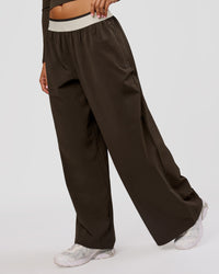 Woman wearing Stride Wide Leg Pant - Ground Coffee | Model:Charli | Size:XS | Thumbnail Index: 2