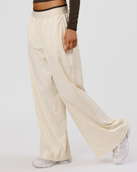 Woman wearing Stride Wide Leg Pant - Vanilla Bean | Model:Charli | Size:XS | Thumbnail Index: 3