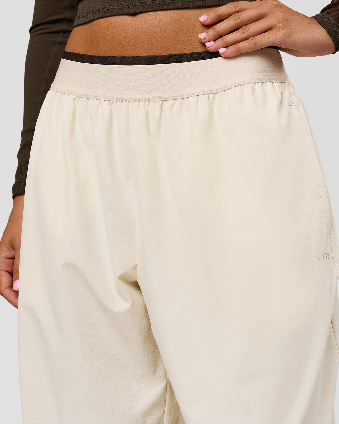 Woman wearing Stride Wide Leg Pant - Vanilla Bean | Model:Charli | Size:XS - view 6
