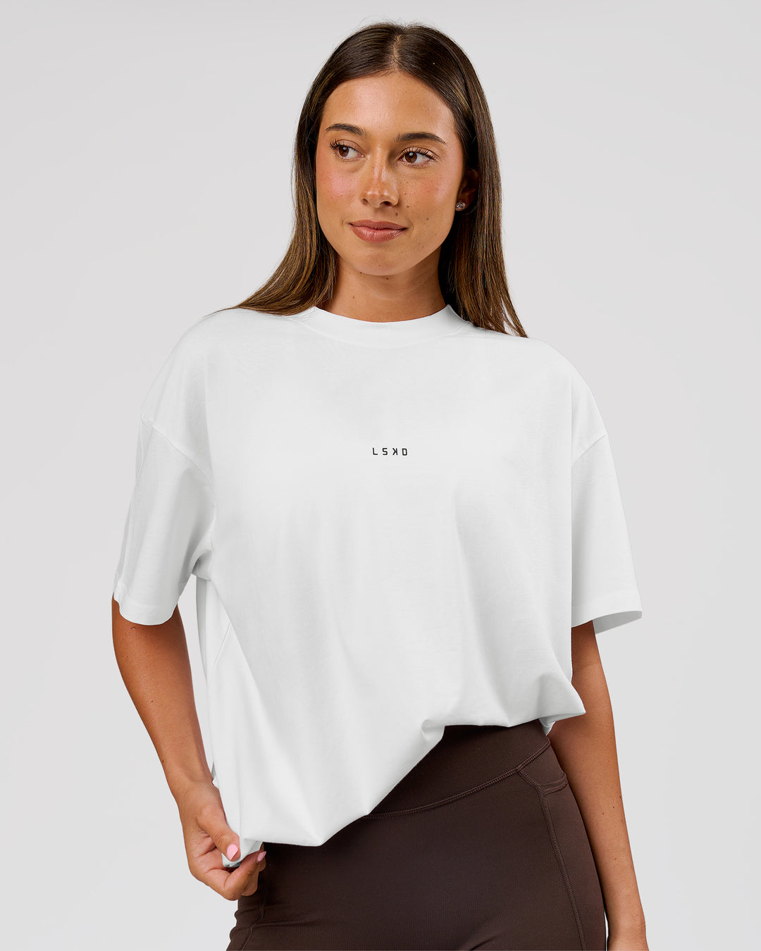 Woman wearing VS26 1% Better FLXCotton Oversize Tee - White-Black | Model:Charli | Size:XS - view 9