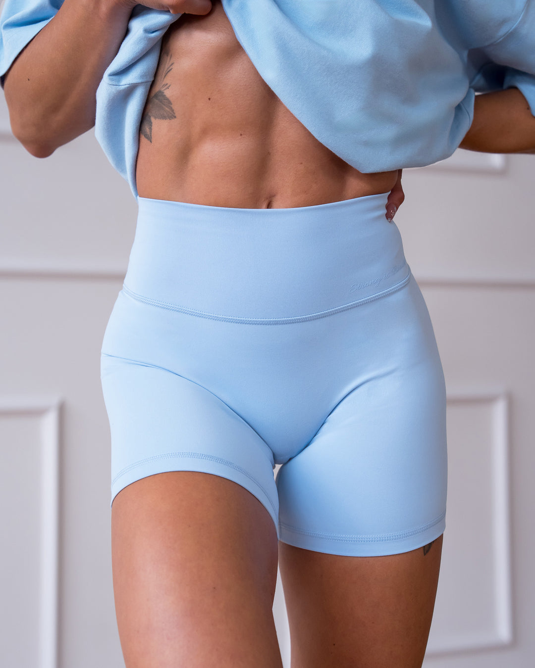 Woman wearing Strong is Beautiful Fusion High-Rise 6" Short - Open Air | Model:Charlotte | Size:XS - view 1
