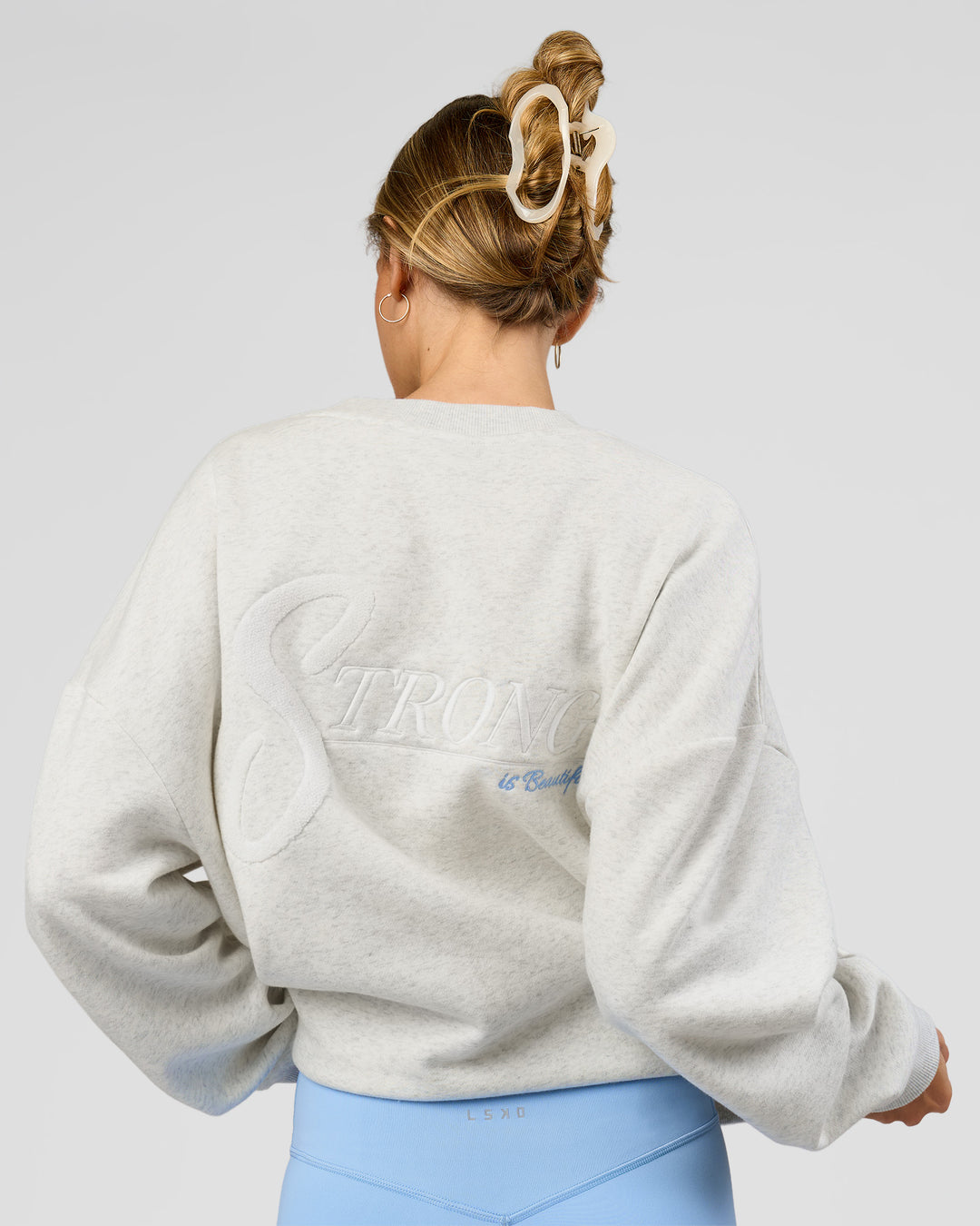 Woman wearing Strong is Beautiful Oversized Sweater - Silver Marl | Model:Georgia | Size:XS - view 3