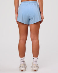 Woman wearing Accelerate 3" Force High-Rise Running Short - Open Air-Lemon | Model:Issy | Size:XS | Thumbnail Index: 1