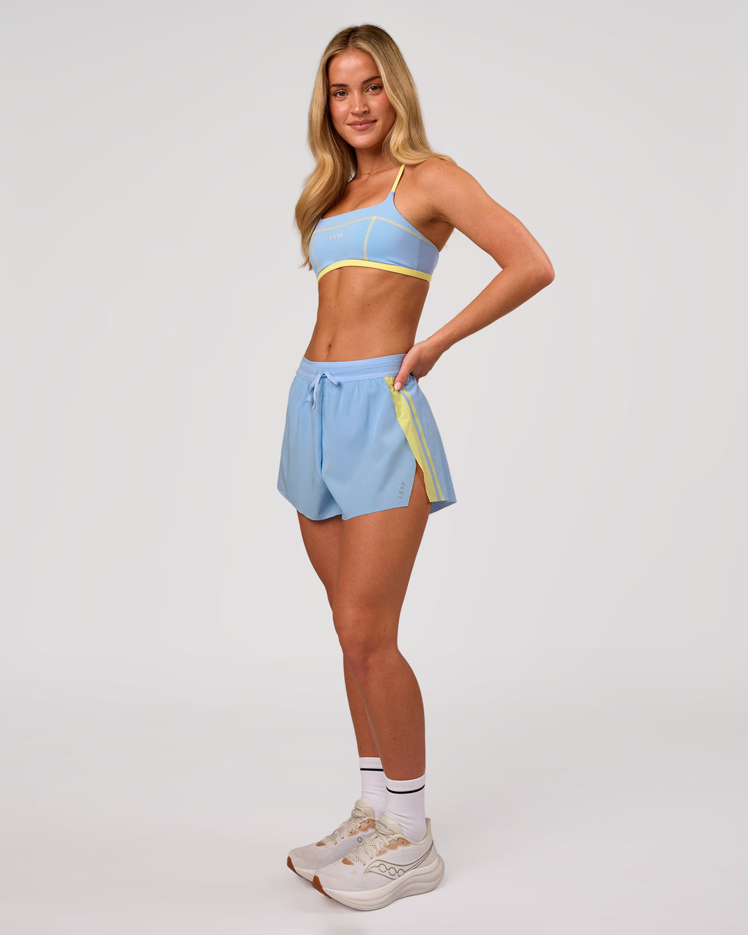 Woman wearing Accelerate 3" Force High-Rise Running Short - Open Air-Lemon | Model:Issy | Size:XS - view 7