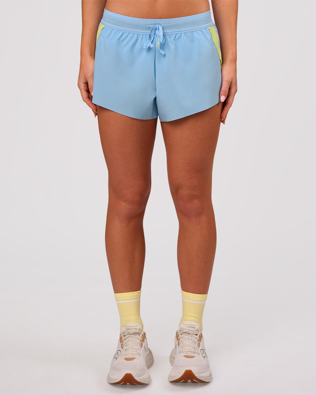 Woman wearing Accelerate 3" Force Mid-Rise Running Short - Open Air-Lemon | Model:Issy | Size:XS - view 10